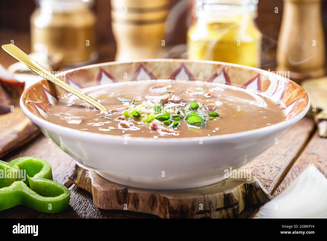 typical Brazilian bean broth, bean soup with bacon, pepperoni, green