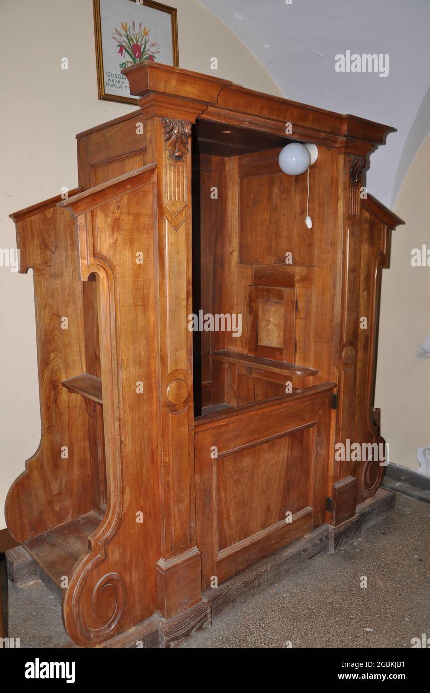 Confession booth in the Sanctuary of the Mother of God Trsat in Rijeka.Wooden confessional in catholic church Stock Photo