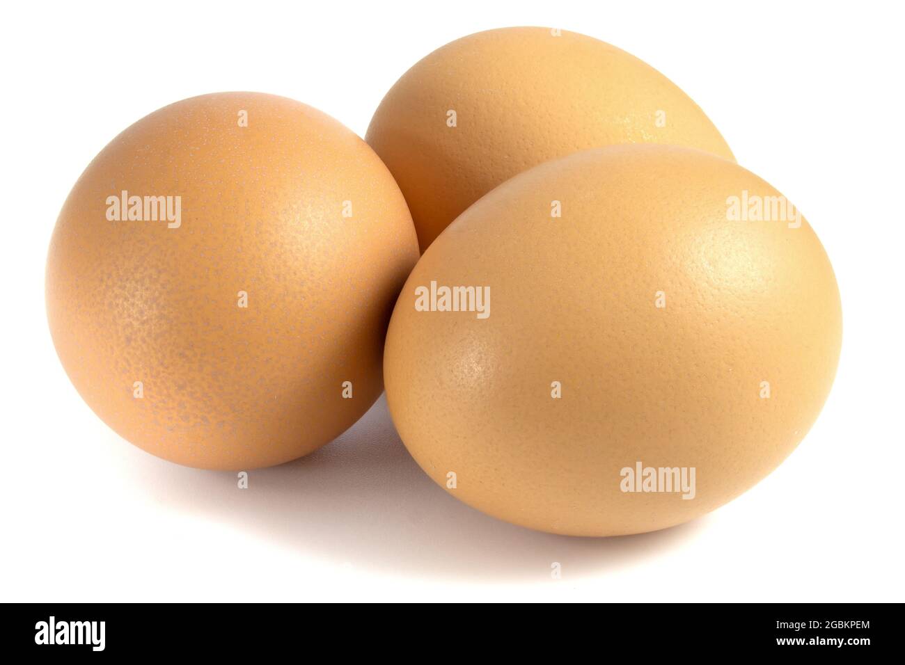 Three chicken eggs isolated on white background Stock Photo