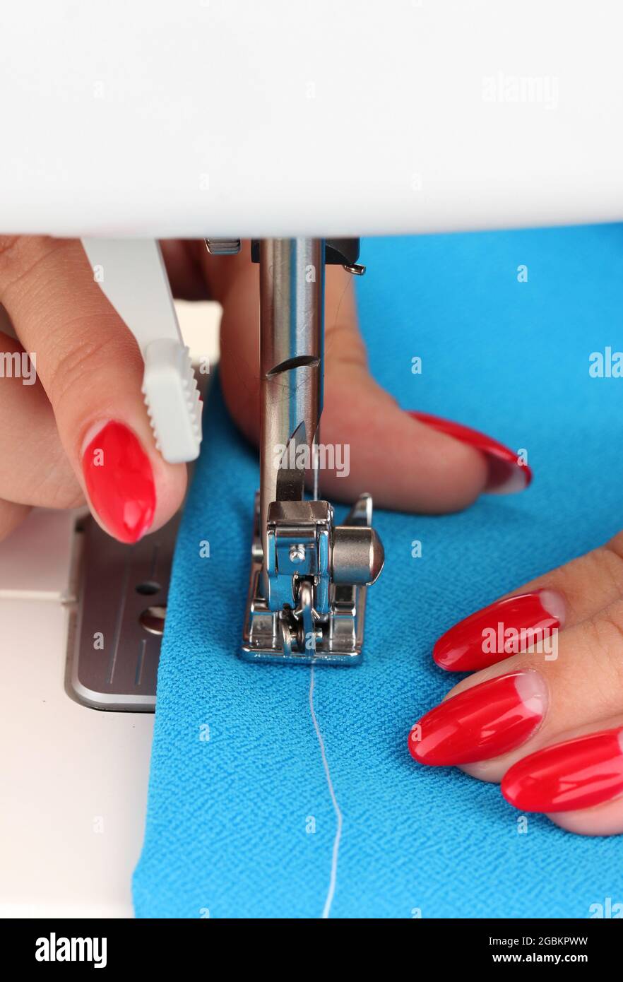 Hand sewing on machine Stock Photo Alamy