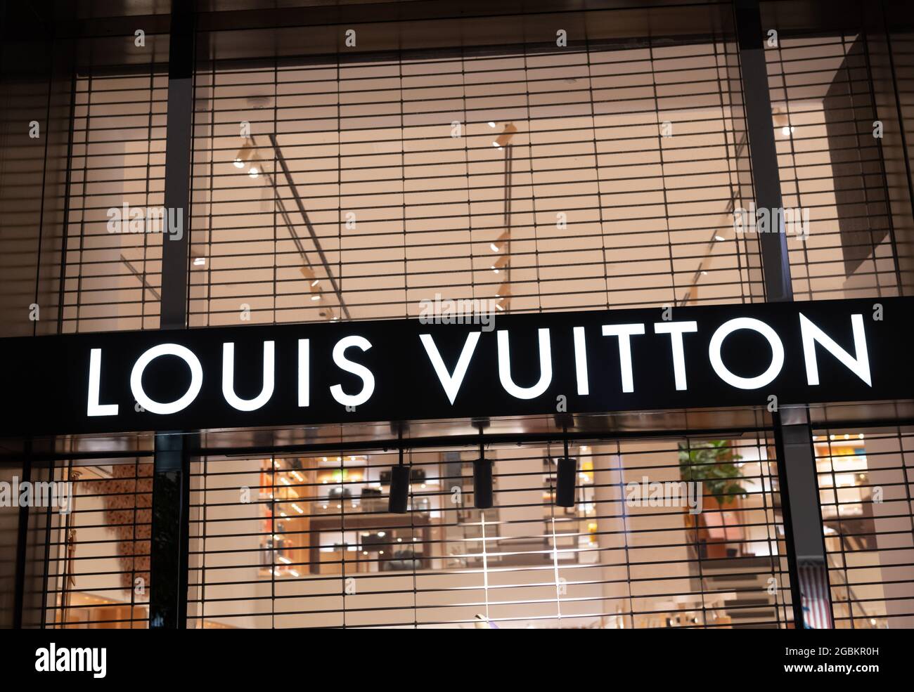 Miami, USA - March 20, 2021: Louis Vuitton name lit up on shop