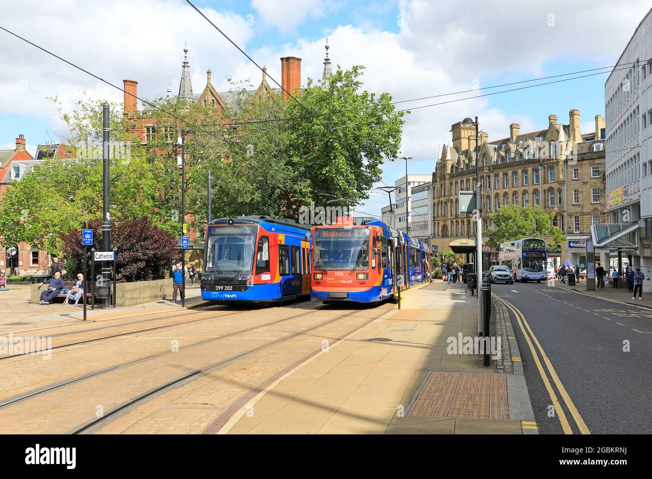 Two trams at the Cathedral tram stop or station, Sheffield, South Yorkshire, England, UK Stock Photo