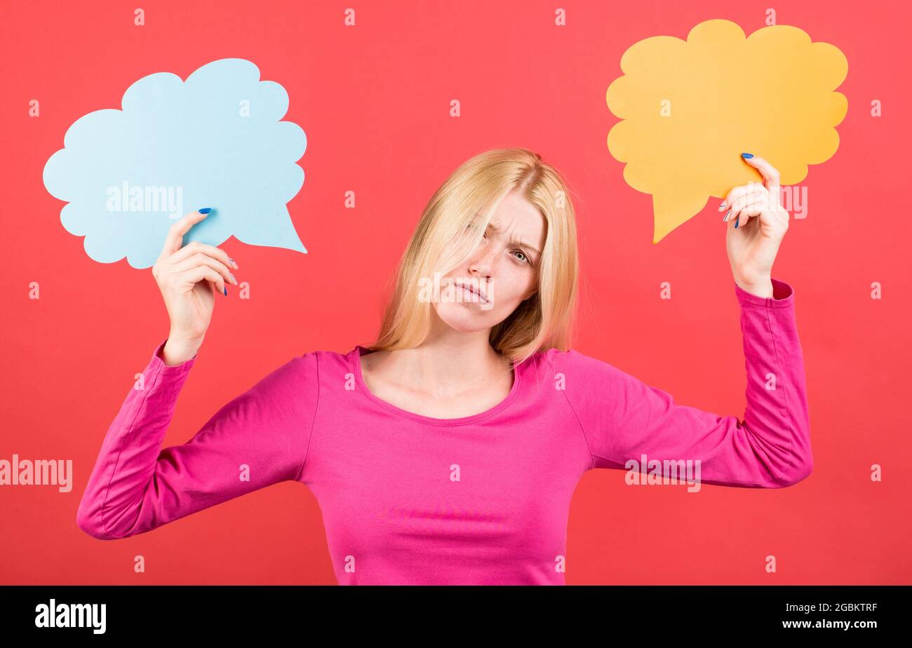 Sad woman with speech bubble. Girl with dialog signs. Make decision. Difficult choice. Stock Photo