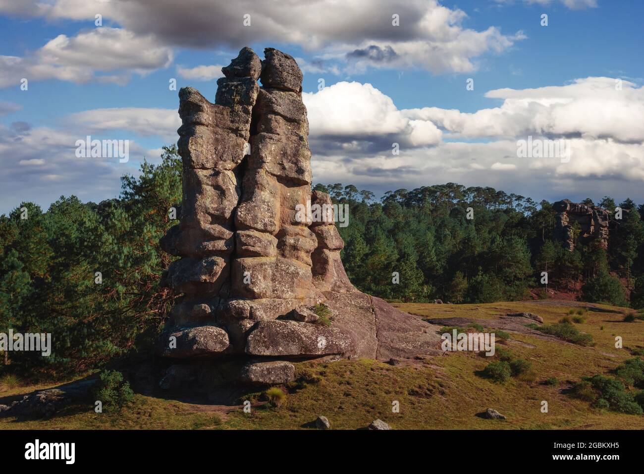 View of a colossal ancestral stone of the natural park 'Piedras Encimadas', Puebla Mexico, the stone and in the background is a beautiful very green p Stock Photo