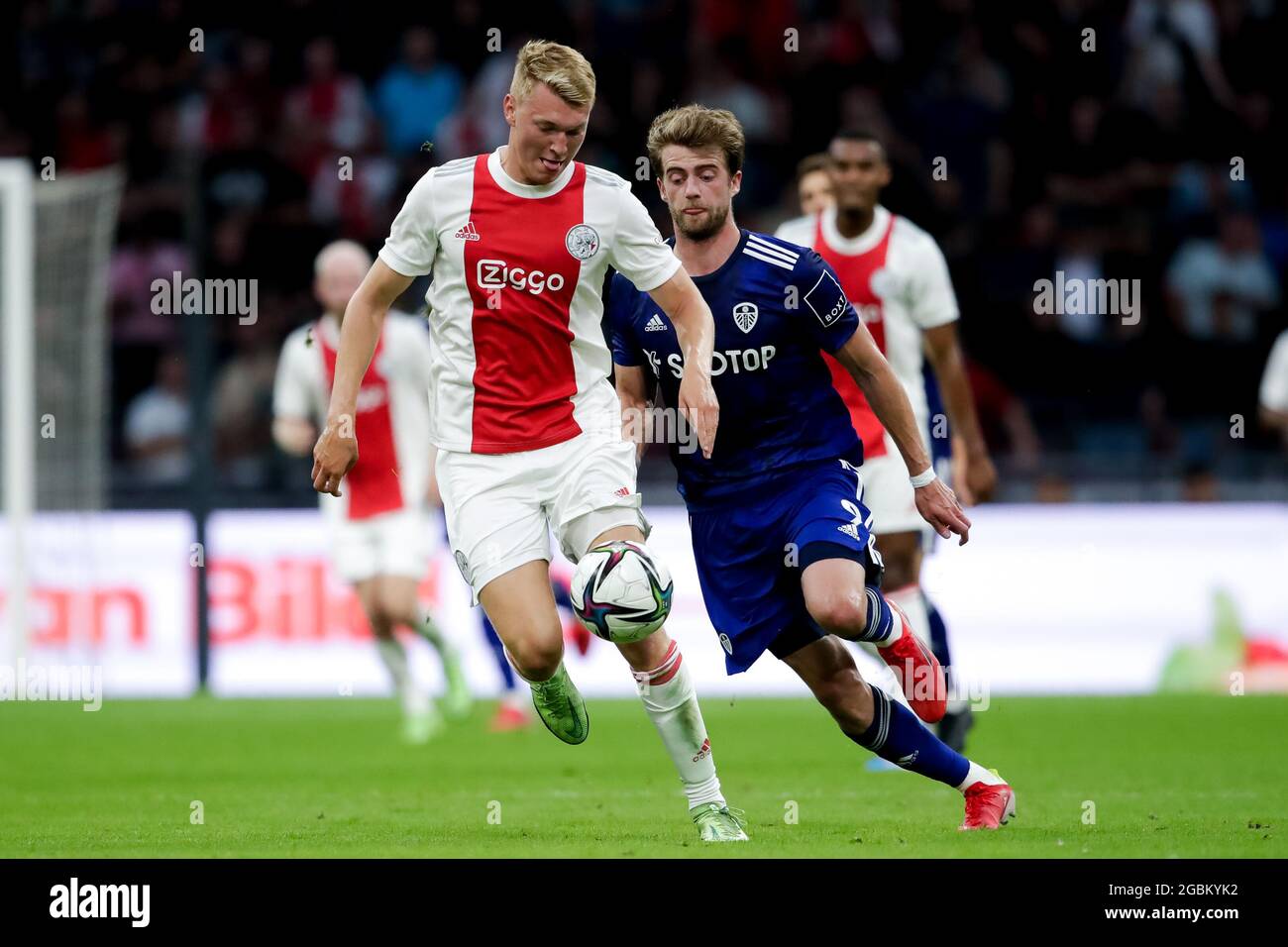 AMSTERDAM, NETHERLANDS - AUGUST 4: Perr Schuurs of Ajax and Patrick Bamford of Leeds United during the Pre-season Friendly match between Ajax and Leeds United at the Johan Cruijff ArenA on August 4, 2021 in Amsterdam, Netherlands (Photo by Broer van den Boom/Orange Pictures) Stock Photo
