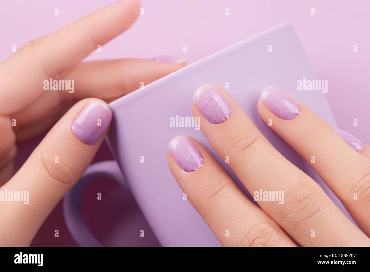 Womans hand with trendy lavender manicure. Spring summer nail ...