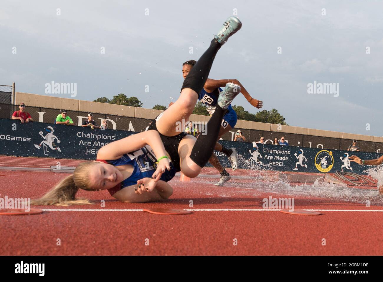 August 4, 2021 Shannon Quinn, left, tumbles during the Girls 2000