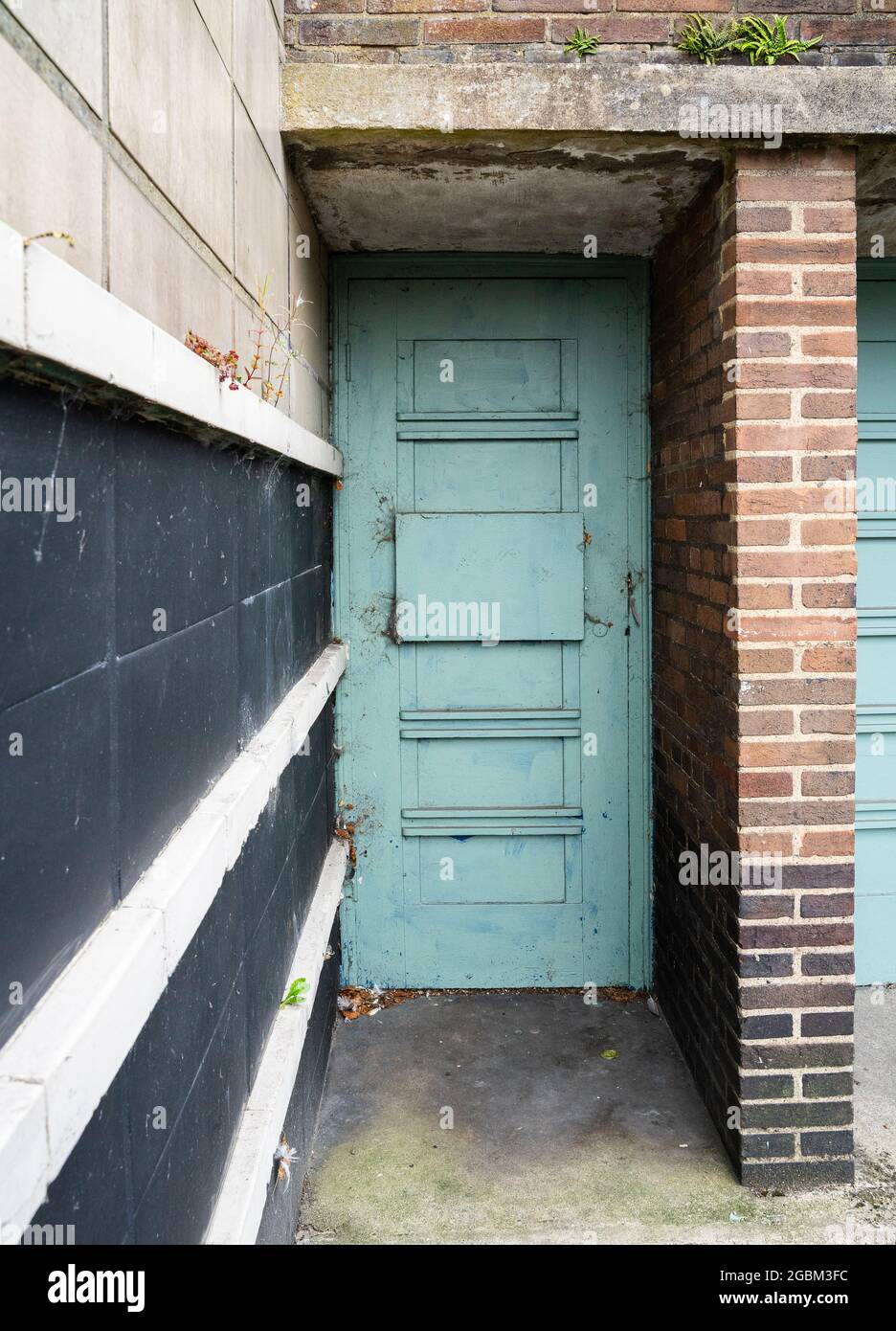 Side door to disused cinema building Stock Photo