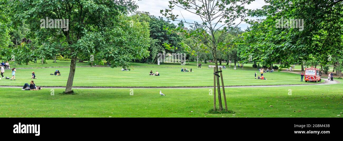 Merrion Square, Dublin, Ireland, people maintaining a social distance during these covid times as they relax on a Sunday afternoon. Stock Photo