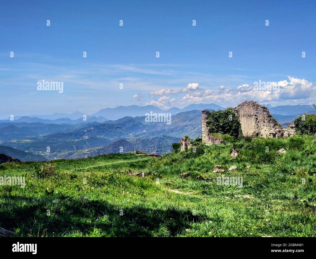 Ruins of an old castle on top of a hill Stock Photo - Alamy
