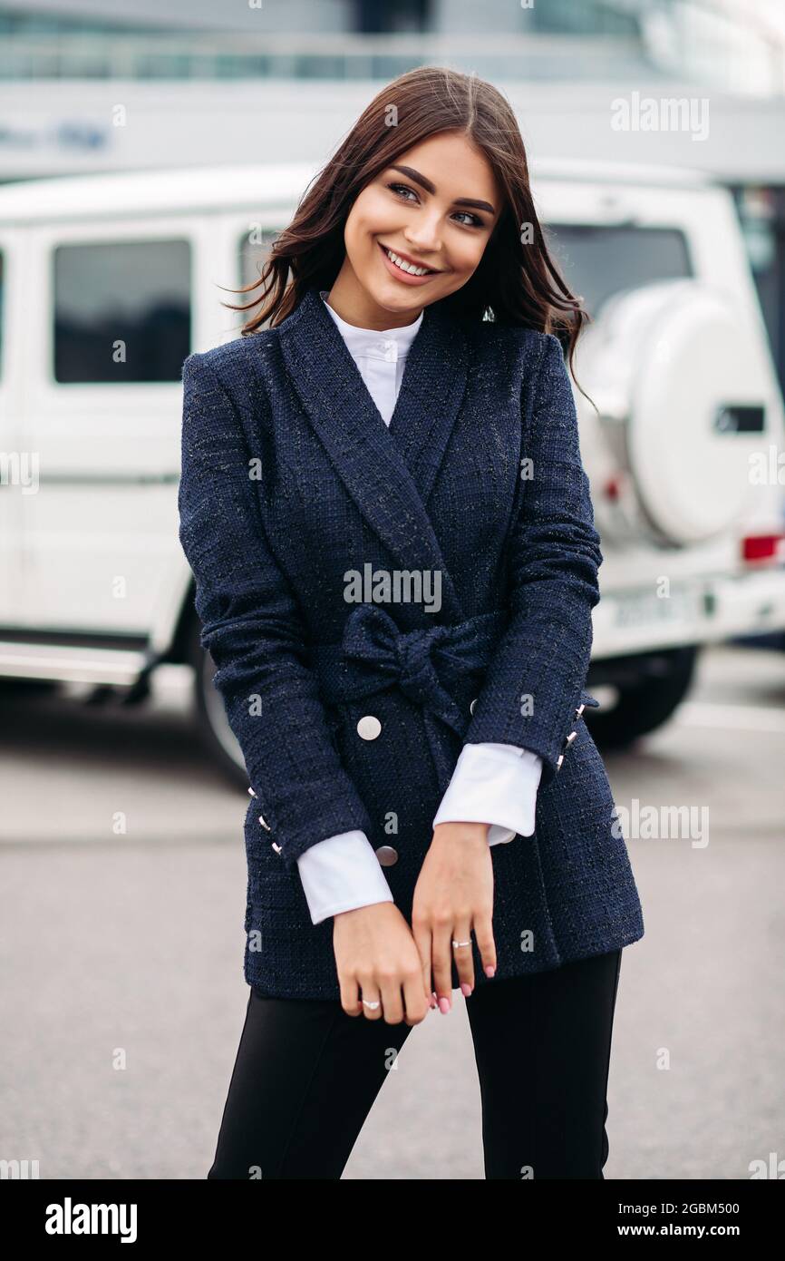 Smiling pretty lady posing in the city Stock Photo