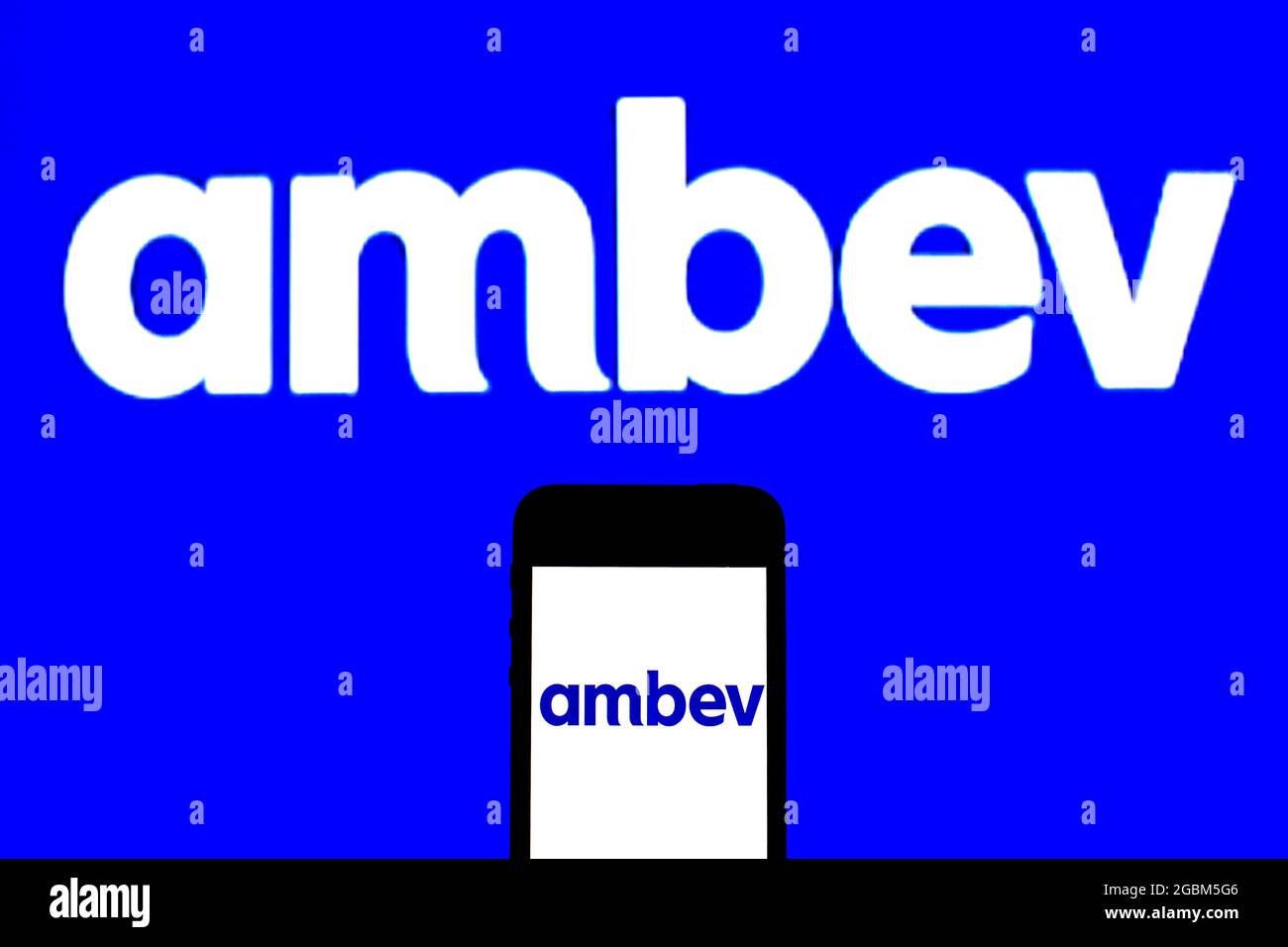 In this photo illustration, a Ambev logo seen displayed on a smartphone ...