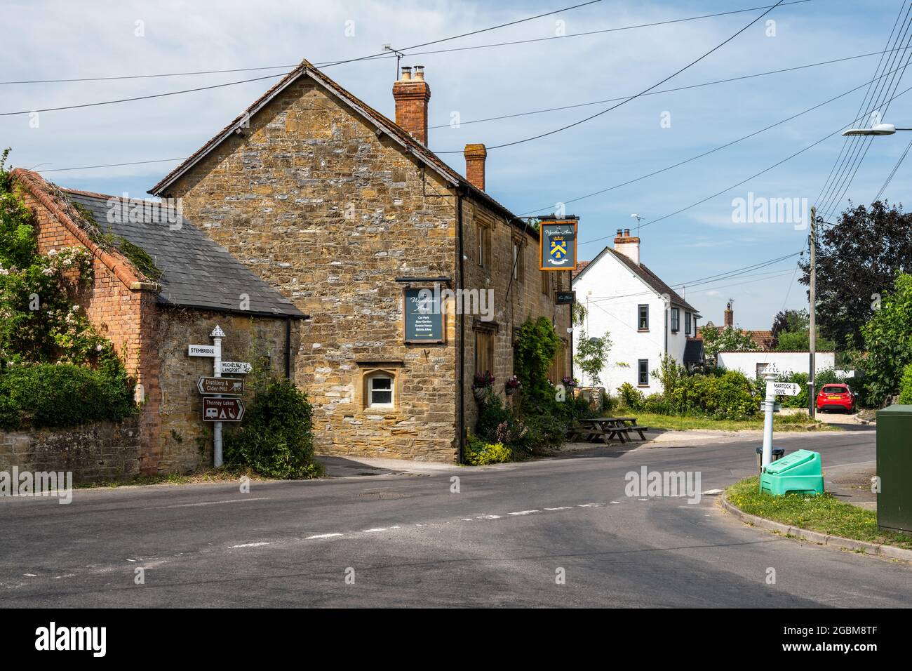 The Wyndham Arms traditional English country pub stands on the main street through Kingsbury Episcopi village in Somerset. Stock Photo