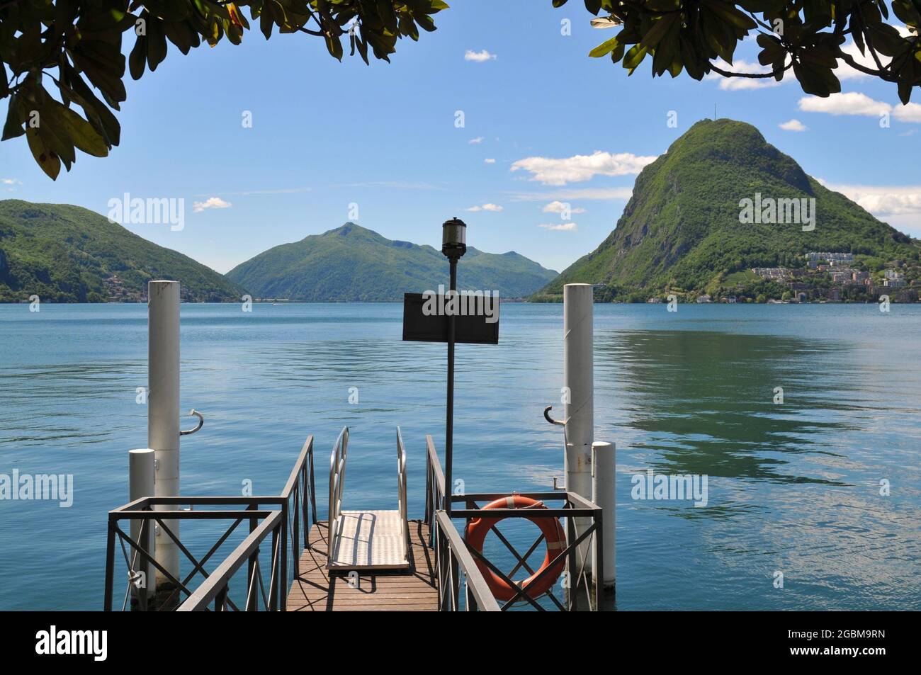 Landscape view of the beautiful Lake Lugano and Monte San Salvatore (also known as Mount San Salvatore) on a sunny summer day Stock Photo
