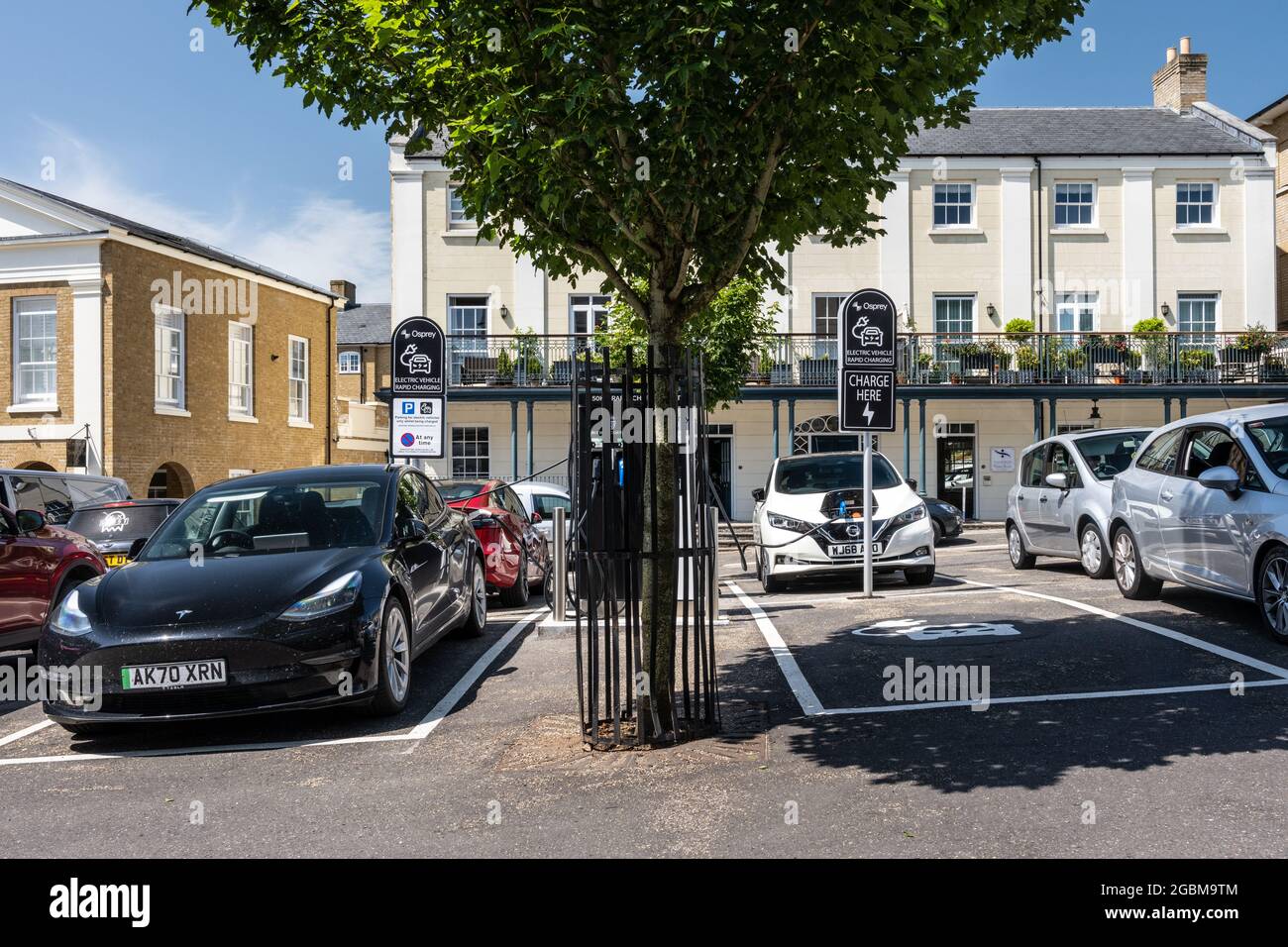 A set of electric car charging points in a car park in Poundbury new town, Dorset. Stock Photo