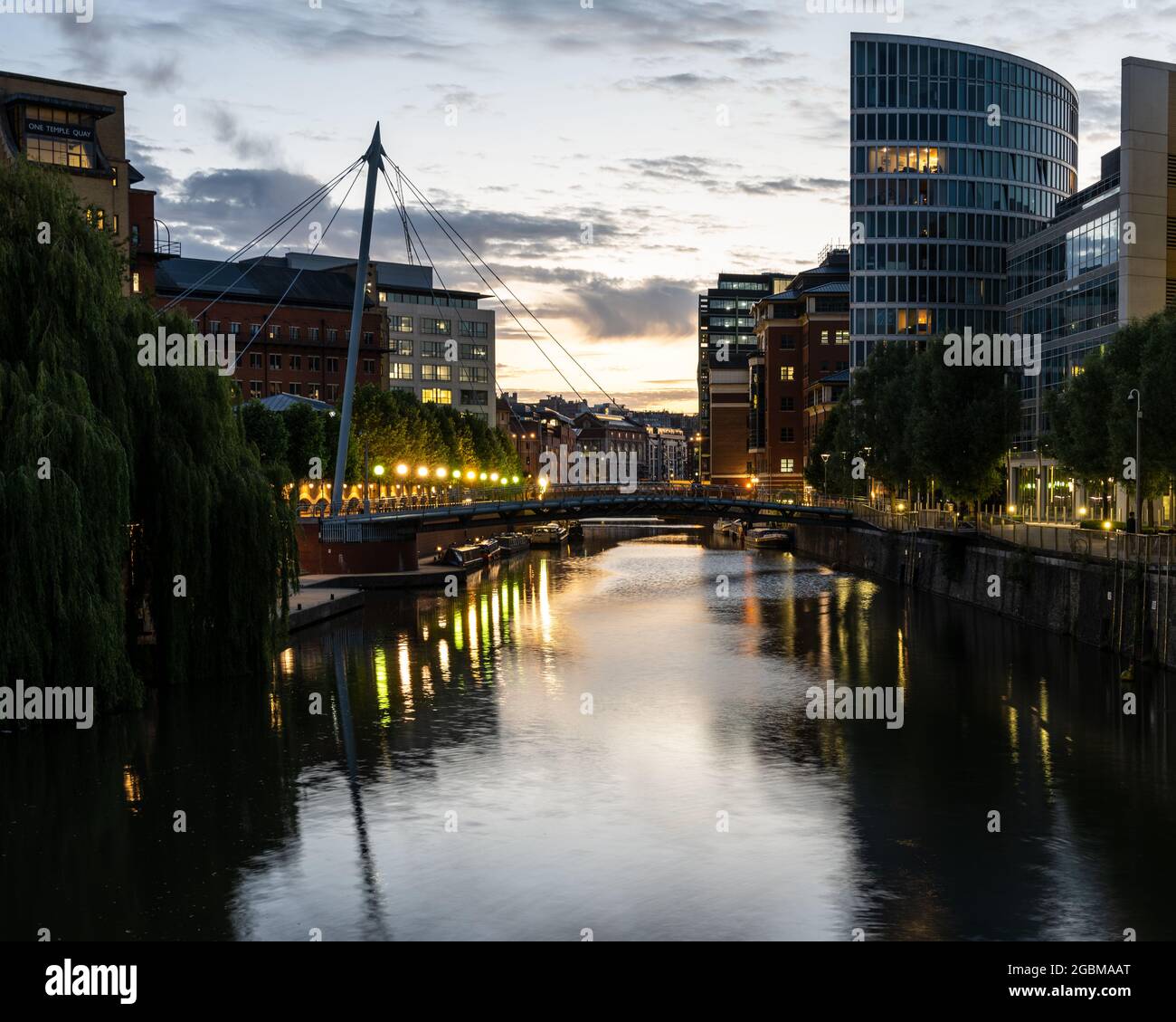 Sunset lights up the sky above Temple Quay on Bristol's Floating Harbour. Stock Photo