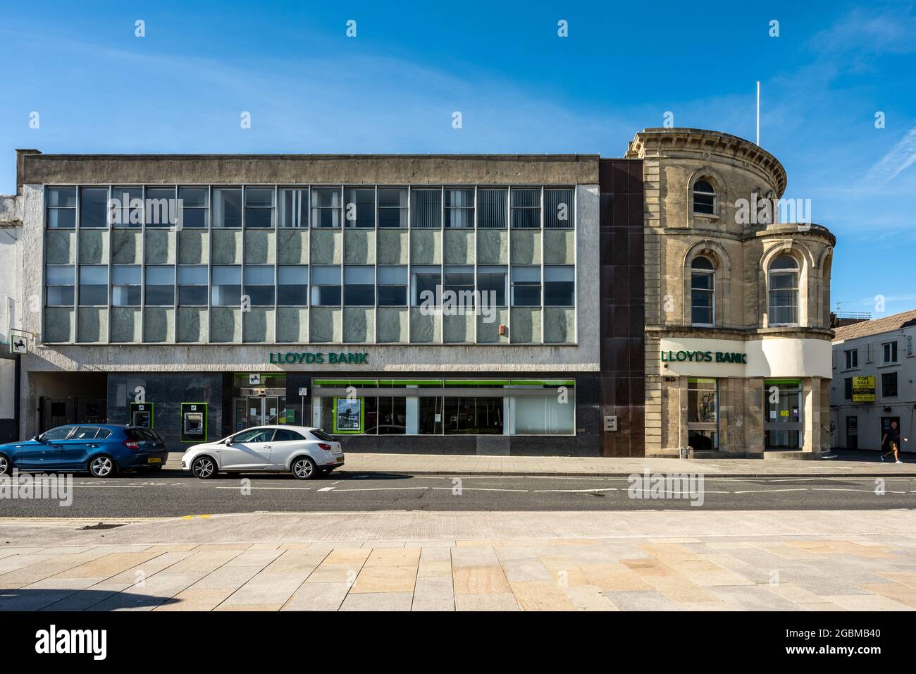 Traditional and modern architectural styles contrast in the Lloyds Bank branch building in Weston-Super-Mare, Somerset. Stock Photo