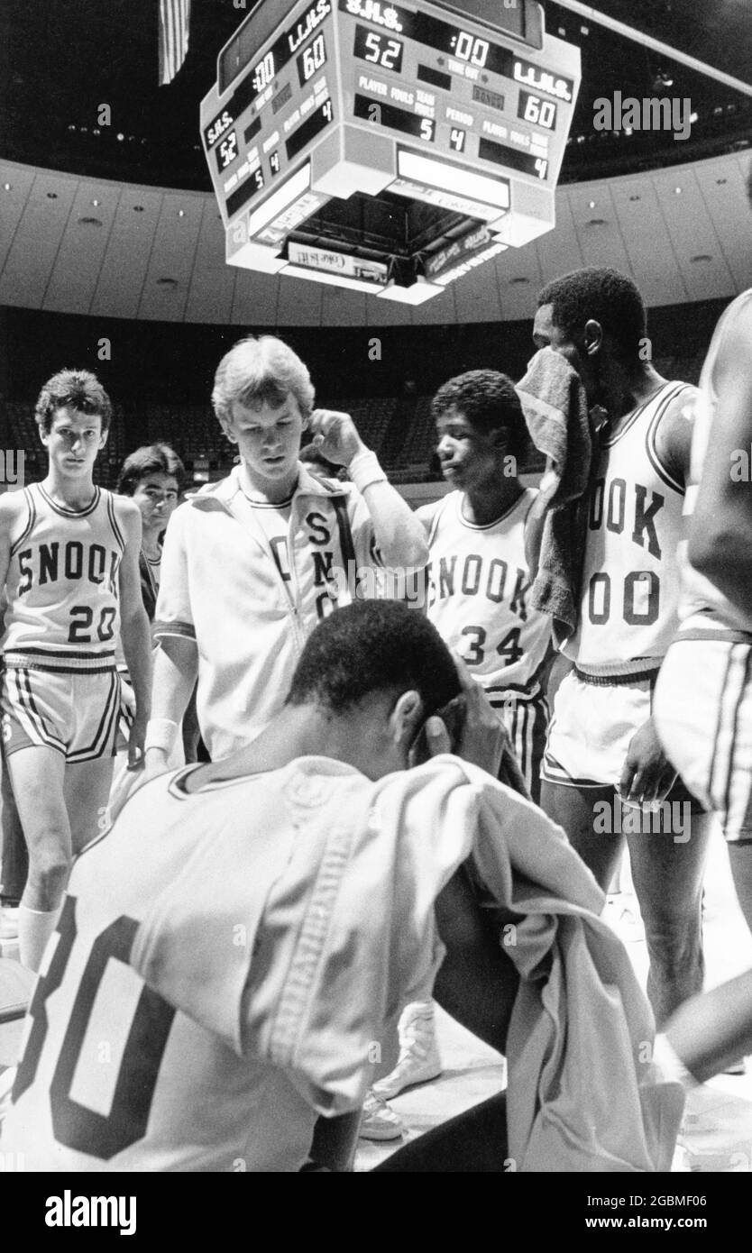 Austin, Texas USA, March 1985: Members of the Snook High School boys' basketball team show their disappointment after loss in state championship tournament semifinals game. ©Bob Daemmrich Stock Photo