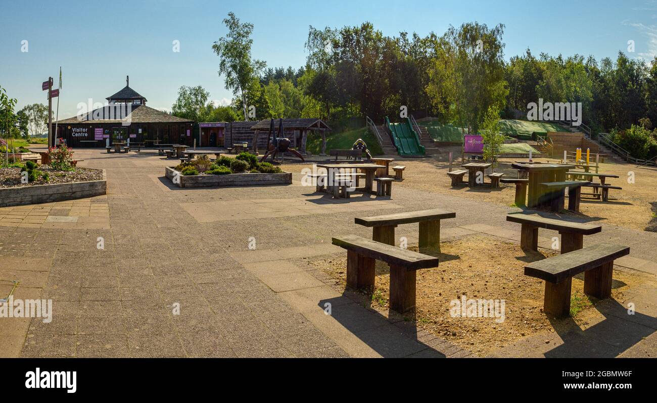 von Heath Country Park visitor centre building with picnic tables and children's play area  on a sunny morning. No people. Saint Leonards, Ringwood. Stock Photo