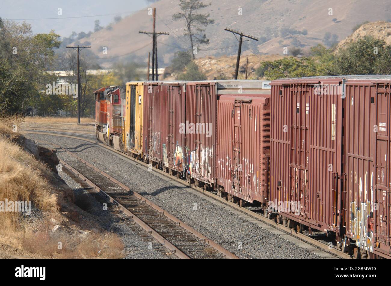 Box cars moving towards Bakersfield, California Stock Photo