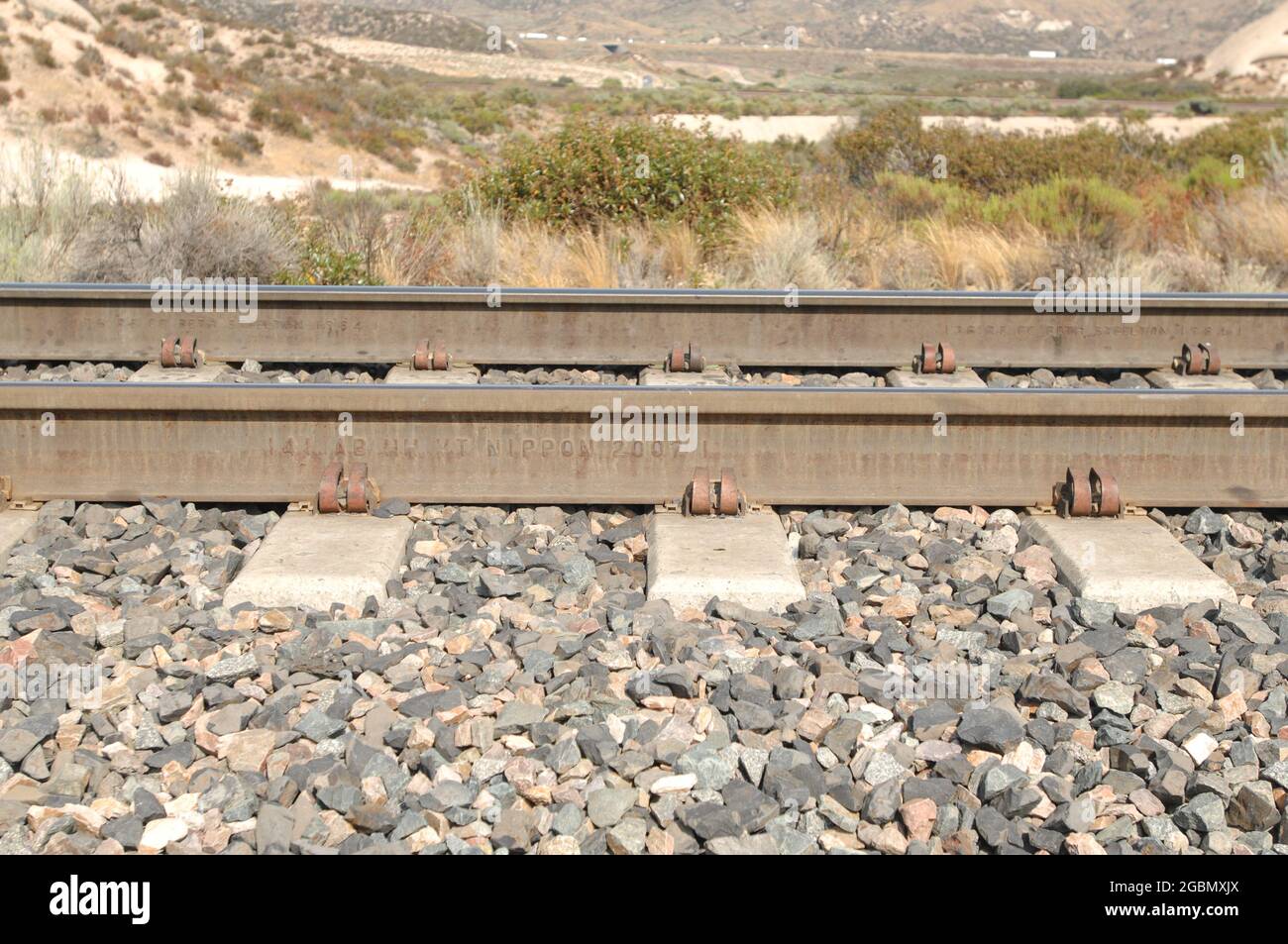 Steel railroad rails near Mormon Rocks in San  Bernardino, California Stock Photo