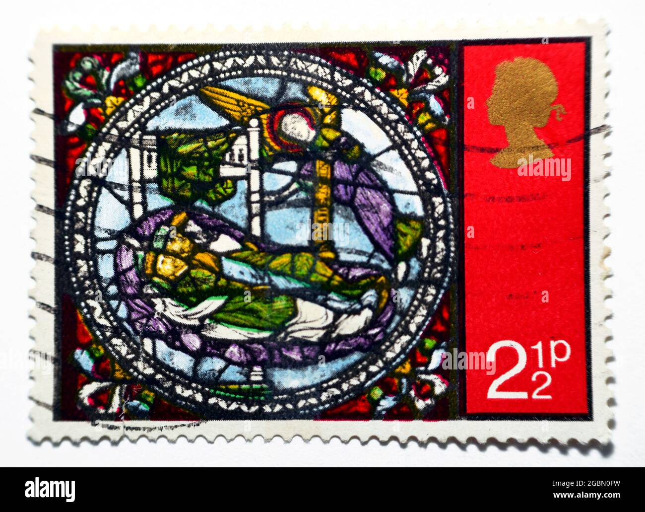 A postage stamp printed in the United Kingdom shows The dream of wise men, dream of the Kings, from Stained Glass Windows, Canterbury Cathedral, circa Stock Photo