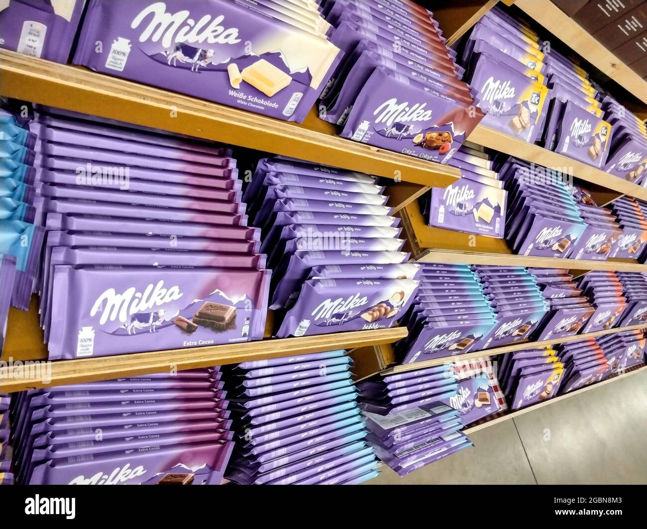 Milka candy bars on store shelf Stock Photo