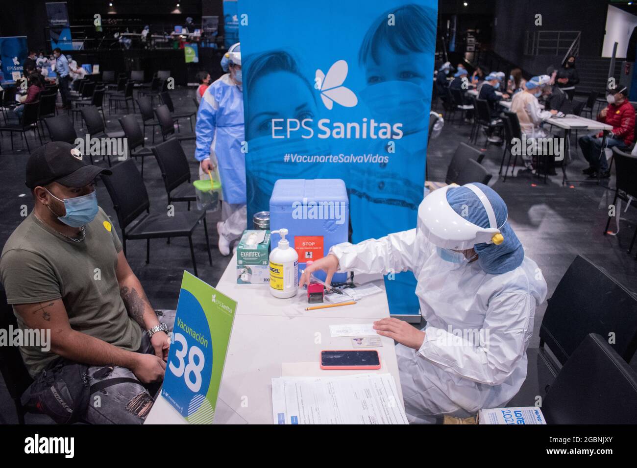 A nurse fills out the Moderna COVID-19 Vaccine consent as people from ages 25 to 30 start their vaccination phase with the Moderna novel COVID-19 vaccine against the Coronavirus disease in Bogota, Colombia on August 3, 2021. Stock Photo