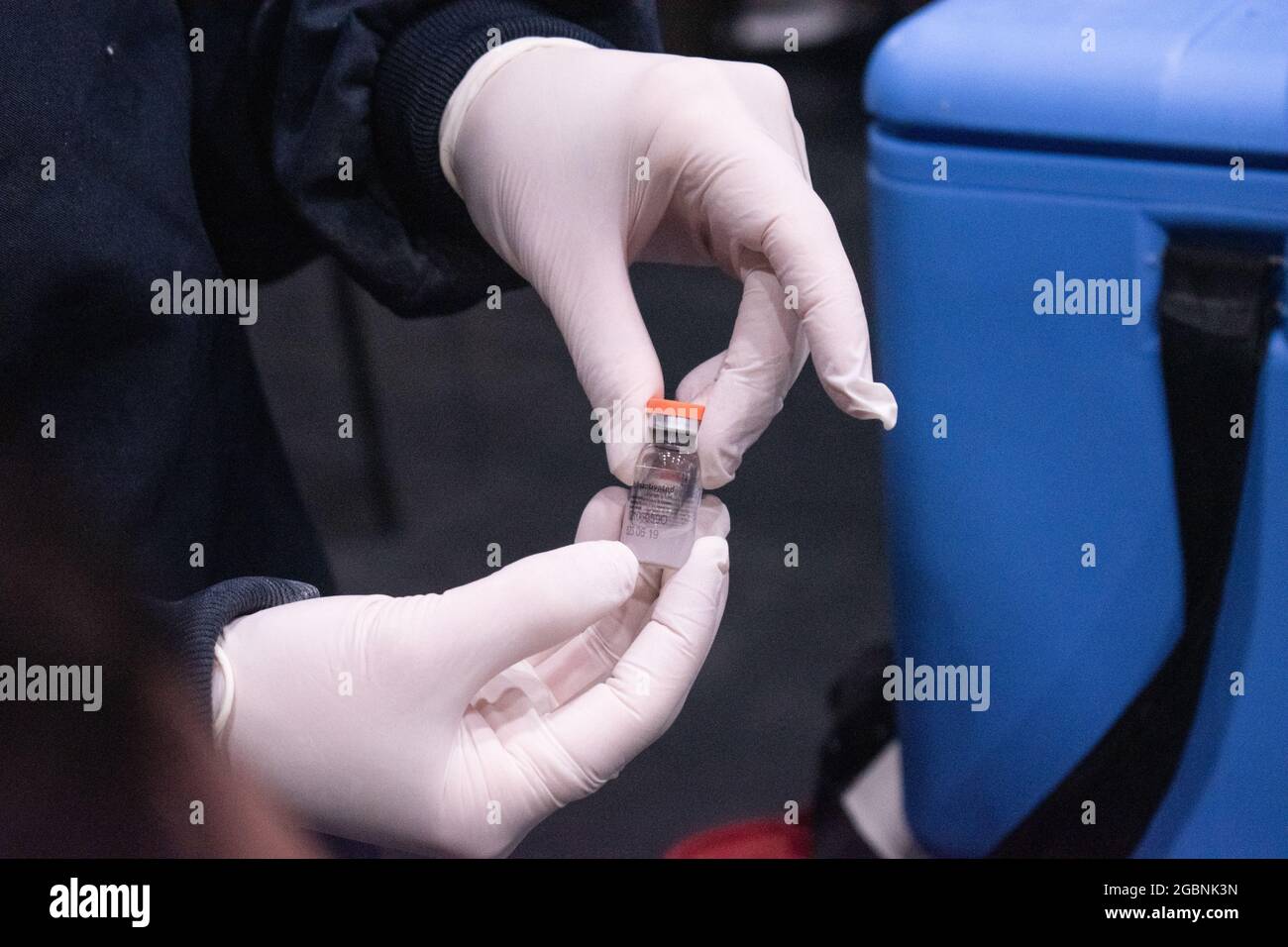 A nurse shows the vial of SINOVAC CoronaVac COVID-19 Vaccine as people from ages 25 to 30 start their vaccination phase with the Moderna novel COVID-19 vaccine against the Coronavirus disease in Bogota, Colombia on August 3, 2021. Stock Photo