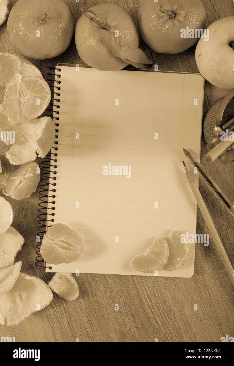 Empty notebook pages and tangerines Stock Photo Alamy