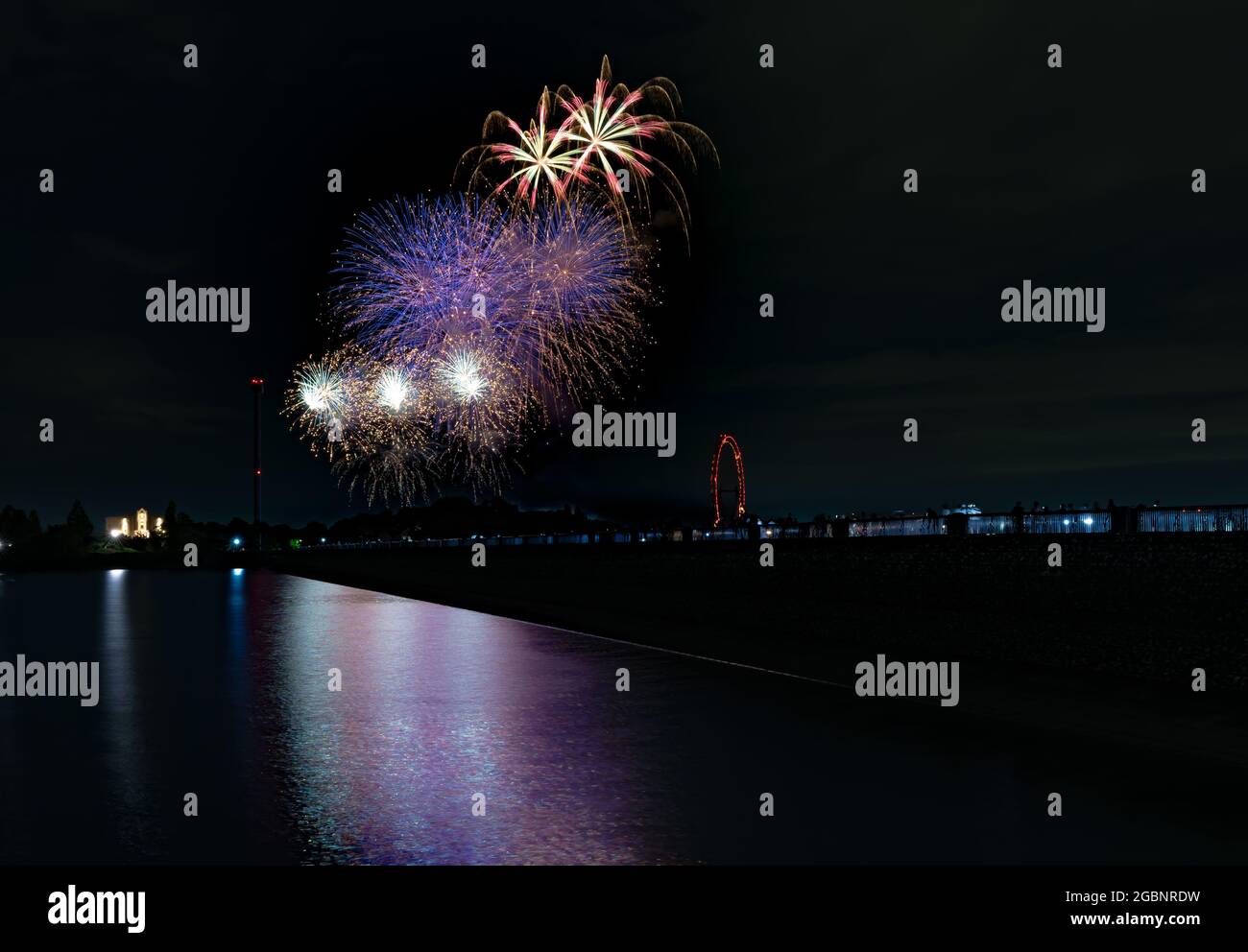 Beautiful Fireworks Celebration In Japan | Summer Season Night Festival | Near The Lake | No People  | Firework With Colourful Shadow Stock Photo