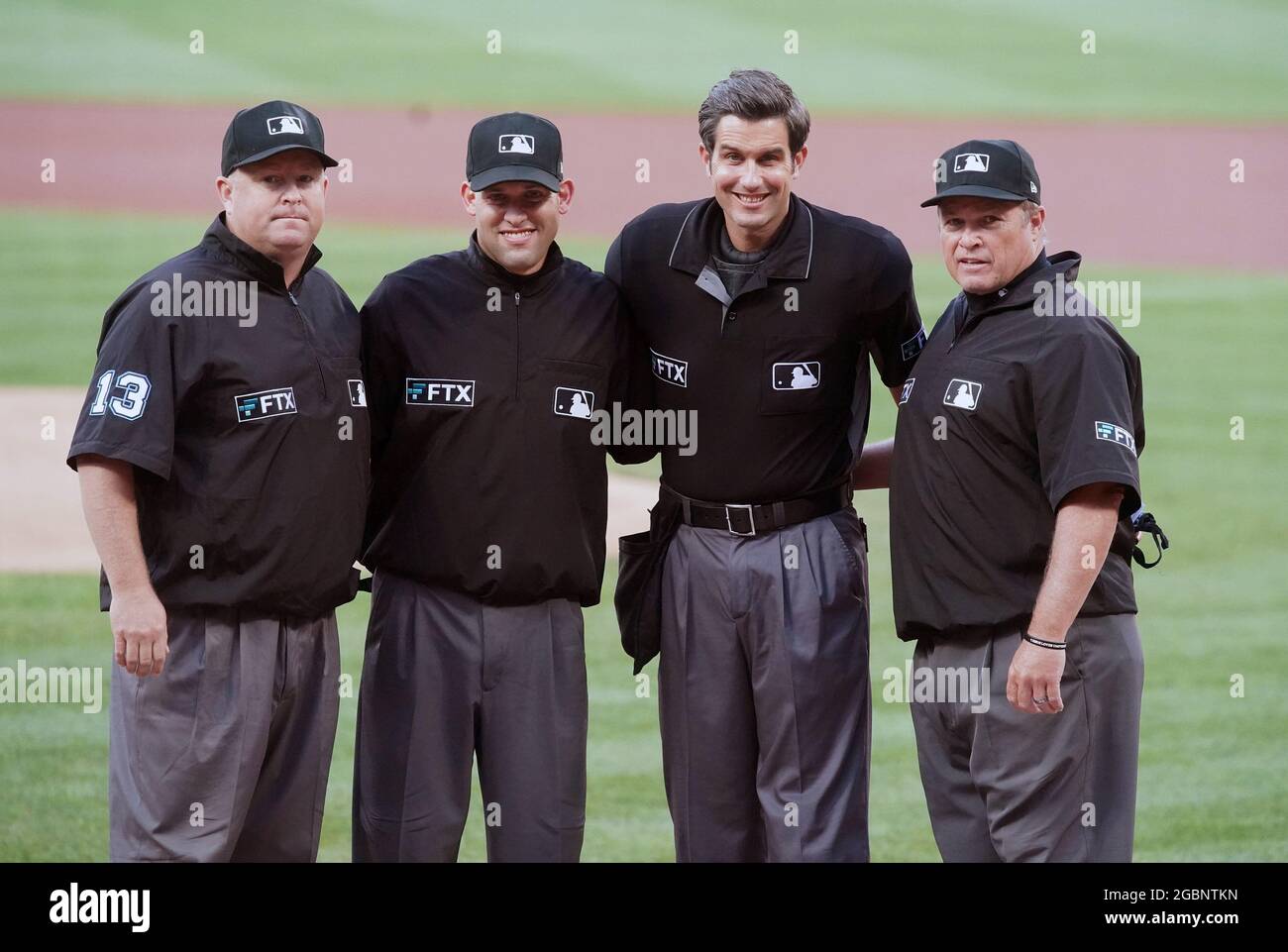 St. Louis, United States. 04th Aug, 2021. Major League Umpires (L to R)  Todd Tichenor, Dan Merzel, John Tumpane and Marvin Hudson pose for a  photograph before the start of the Atlanta