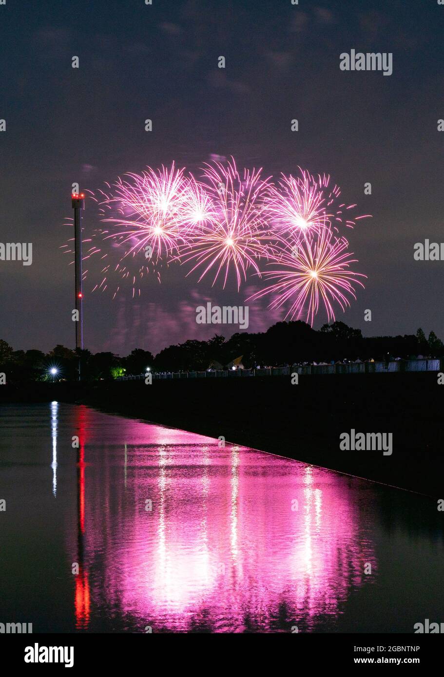 Beautiful Fireworks Celebration In Japan | Summer Season Night Festival | Near The Lake | No People  | Firework With Colourful Shadow Stock Photo