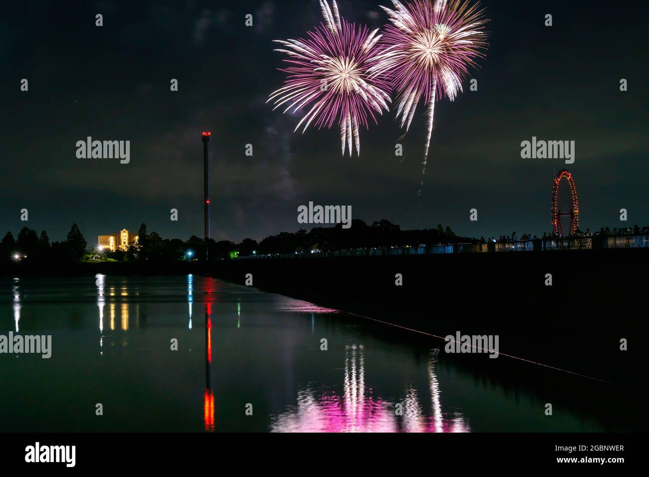 Beautiful Fireworks Celebration In Japan | Summer Season Night Festival | Near The Lake | No People  | Firework With Colourful Shadow Stock Photo