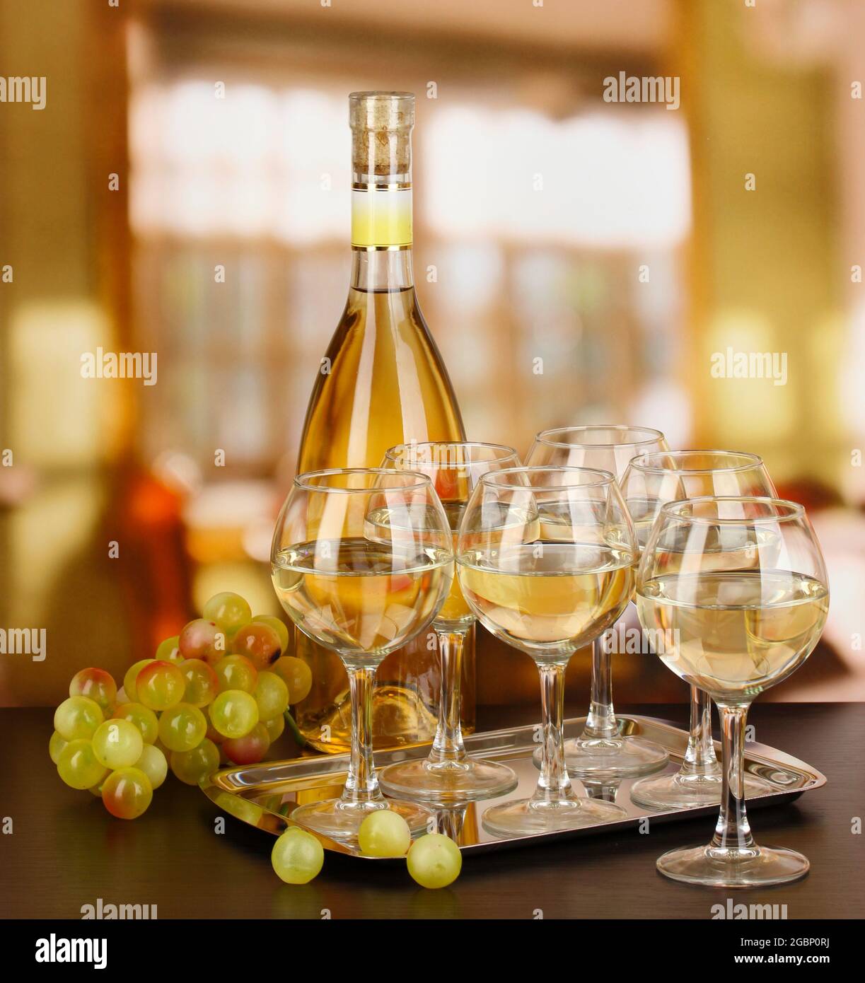 White wine in glass and bottle on room background Stock Photo Alamy