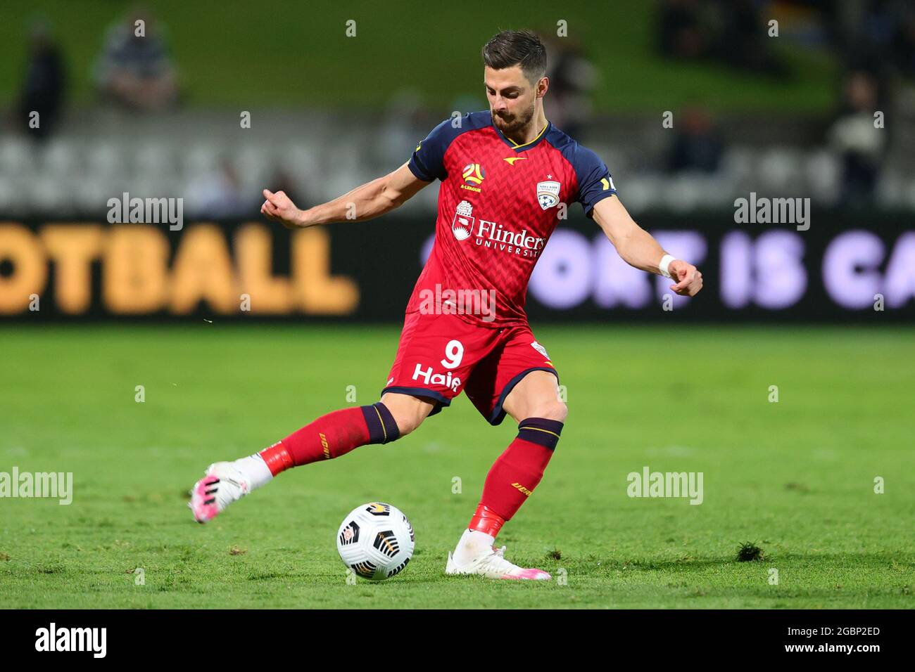 SYDNEY, AUSTRALIA - JUNE 19: Tomi Juric of Adelaide United crosses the ball during the A-League semi-final soccer match between Sydney FC and Adelaide United on June 19, 2021 at Netstrata Jubilee Stadium in Sydney, Australia. Credit: Pete Dovgan/Speed Media/Alamy Live News Stock Photo