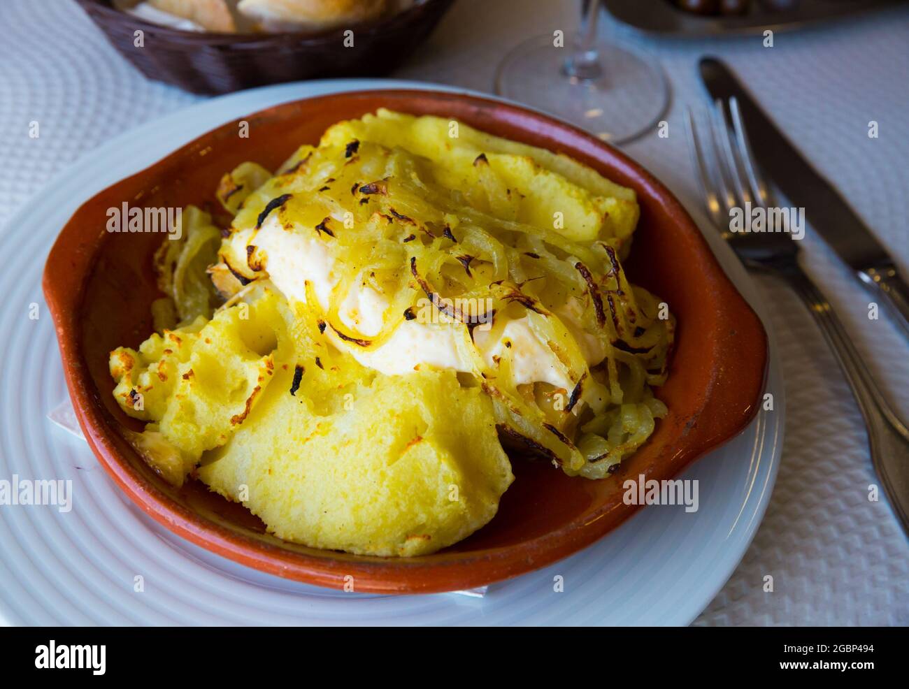 Cod fillet baked with potato Stock Photo - Alamy