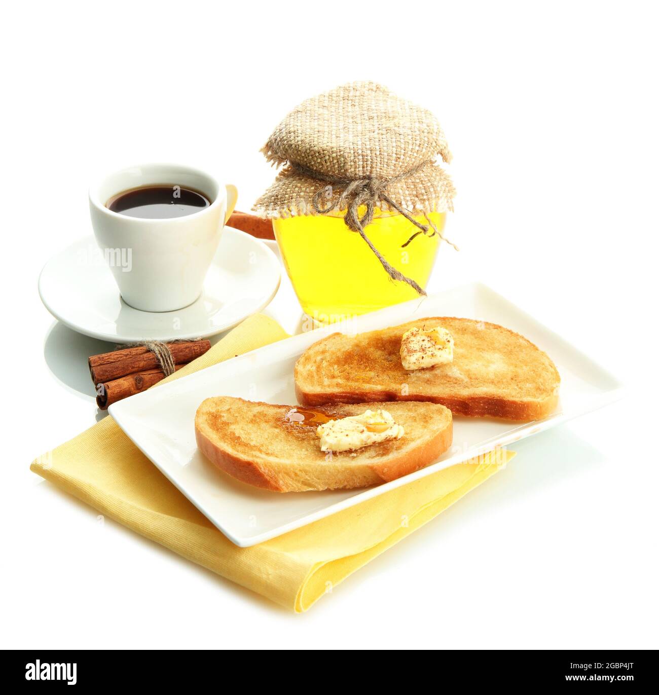 White bread toast with honey and cup of coffee, isolated on white Stock