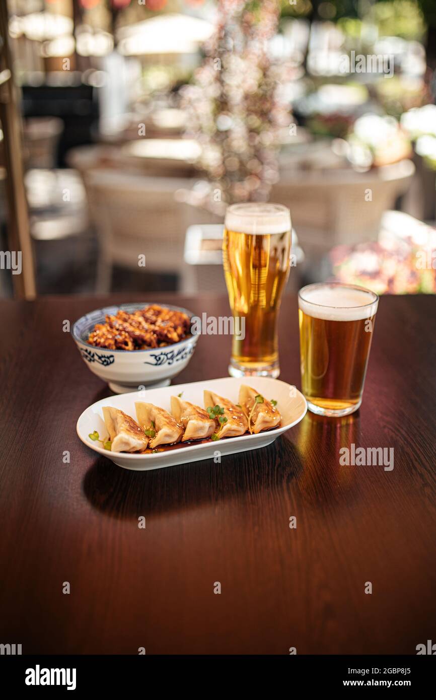 Japanese gedza and katsudon chicken rice with beer Stock Photo