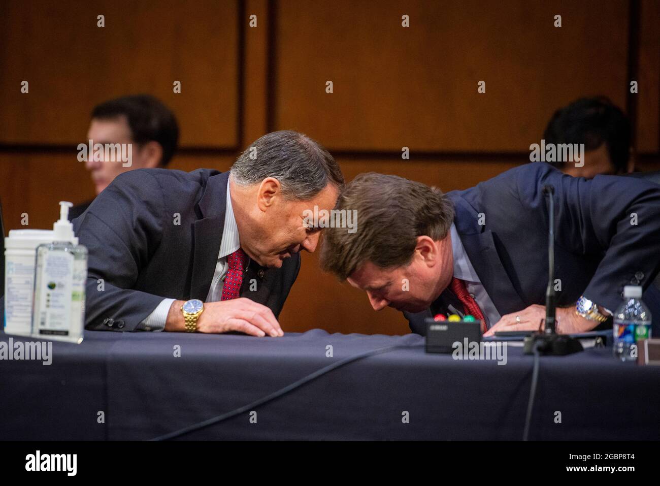 Washington, United States Of America. 04th Aug, 2021. United States Senator Mike Rounds (Republican of South Dakota), left, confers with United States Senator Bill Hagerty (Republican of Tennessee), right, during a Senate Committee on Foreign Relations business meeting for nominations and legislative considerations in the Hart Senate Office Building in Washington, DC, Wednesday, August 4, 2021. Credit: Rod Lamkey/CNP/Sipa USA Credit: Sipa USA/Alamy Live News Stock Photo