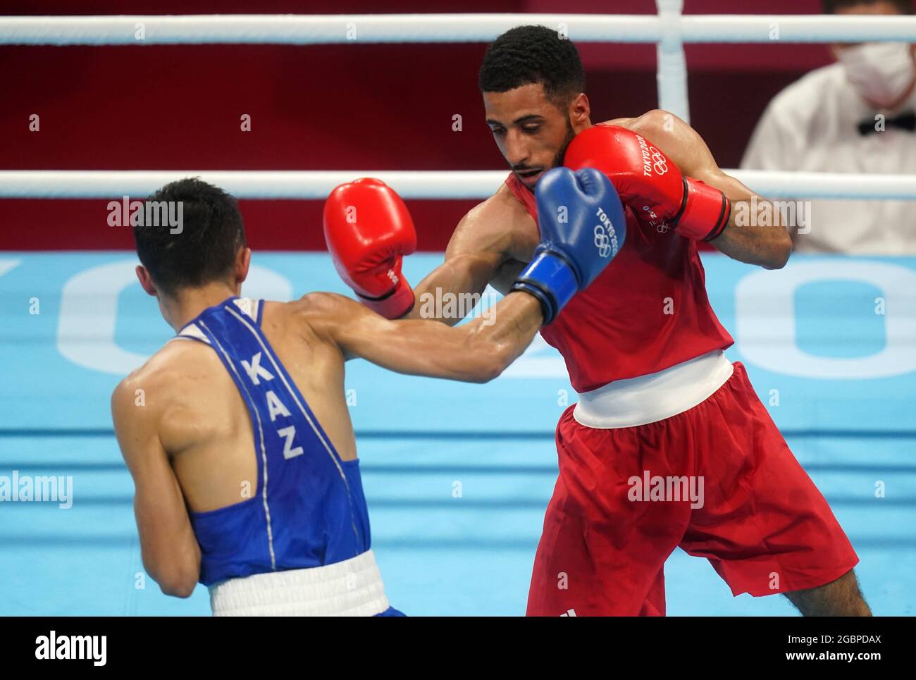 Great Britain's Galal Yafai (right) and Kazakhstan's Saken ...