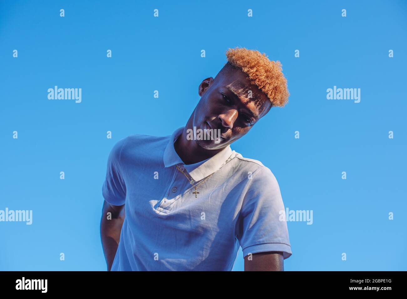 Close up portrait of young man with orange colored hair Stock Photo
