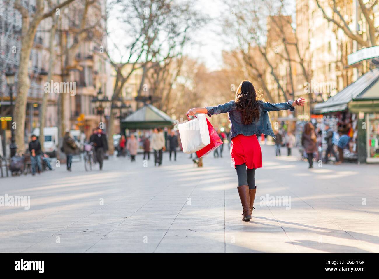 Happy shopping woman walking with bags on Barcelona, La Rambla famous ...