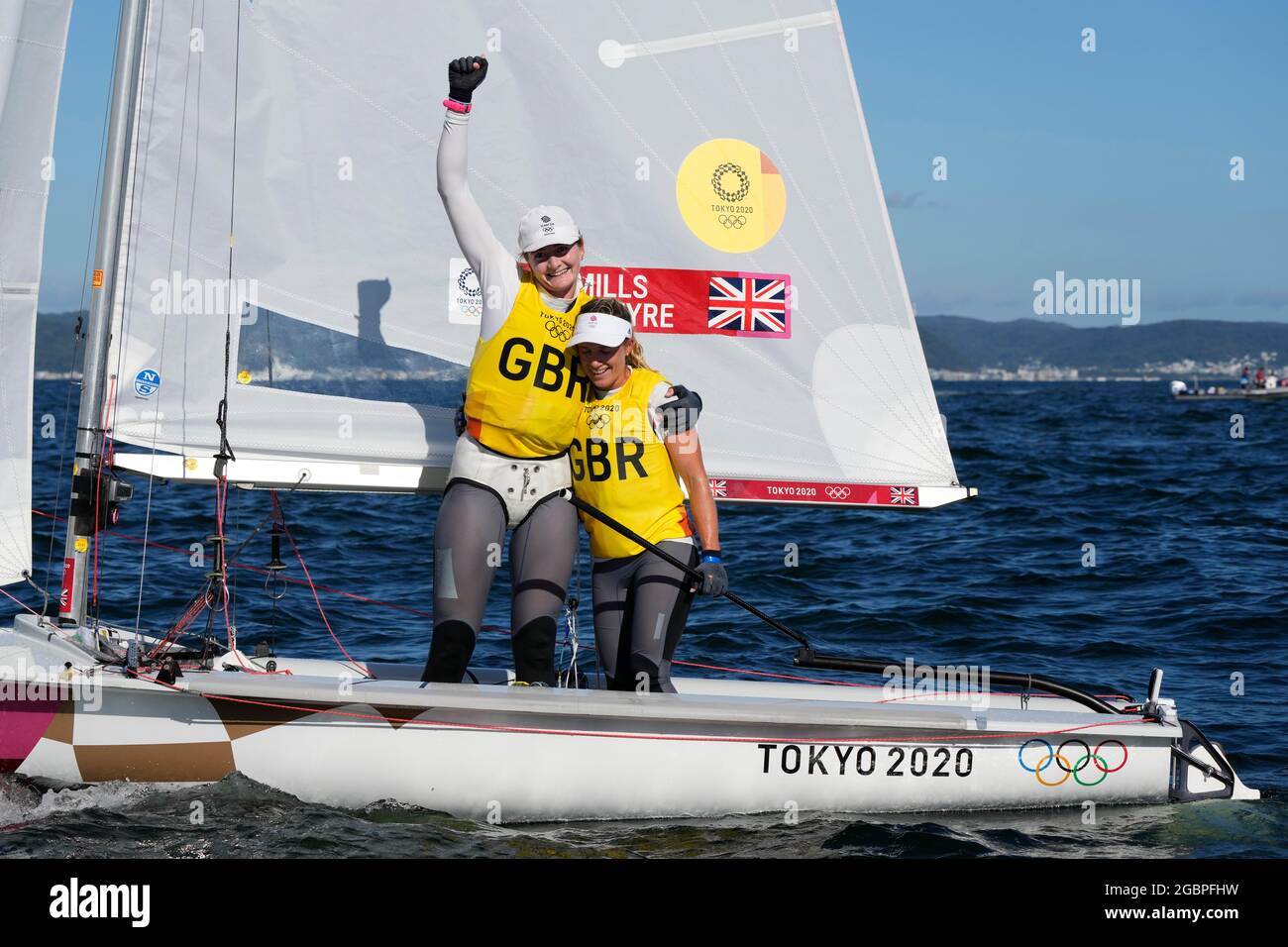 Great Britain's Hannah Mills and Eilidh McIntyre celebrate winning Gold after the Women's Two Person Dinghy 470 Medal race during the Sailing at Enoshima on the thirteenth day of the Tokyo 2020 Olympic Games in Japan. Picture date: Wednesday August 4, 2021. Stock Photo