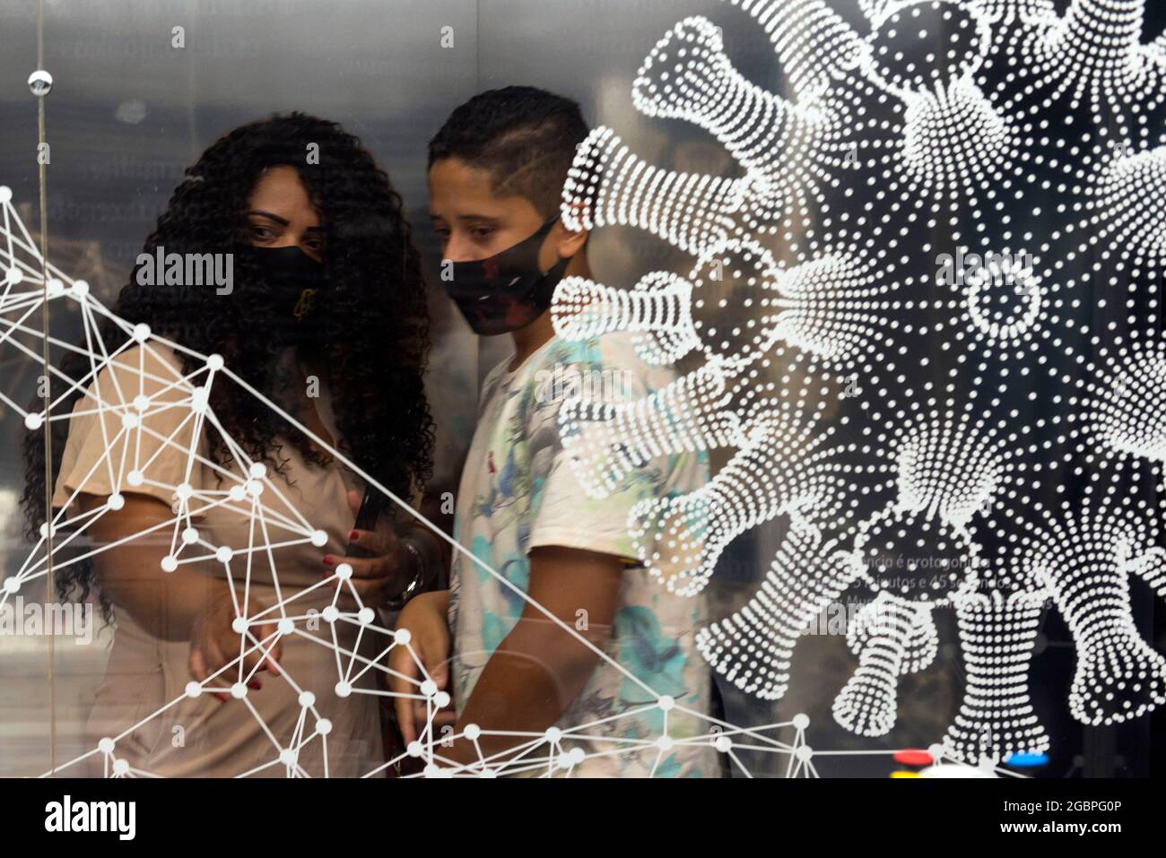 Beijing, Brazil. 11th Mar, 2021. People visit an exhibition themed on COVID-19 pandemic in Rio de Janeiro, Brazil, March 11, 2021. Credit: Luciana Whitaker/Xinhua/Alamy Live News Stock Photo