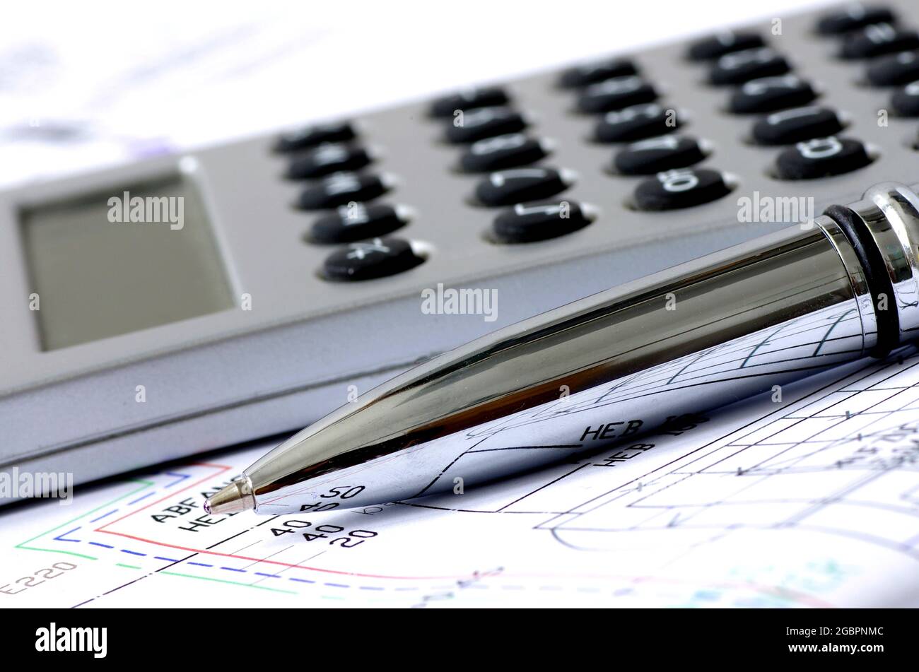 Plan, calculator and silver pen Stock Photo