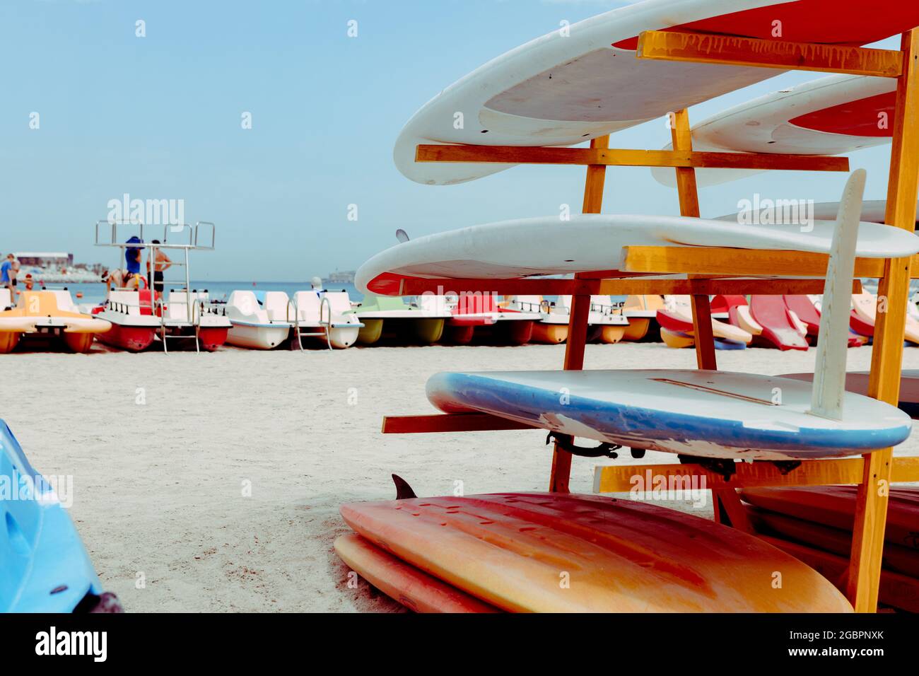 Surfboards stacked on the rack on a beach Stock Photo - Alamy