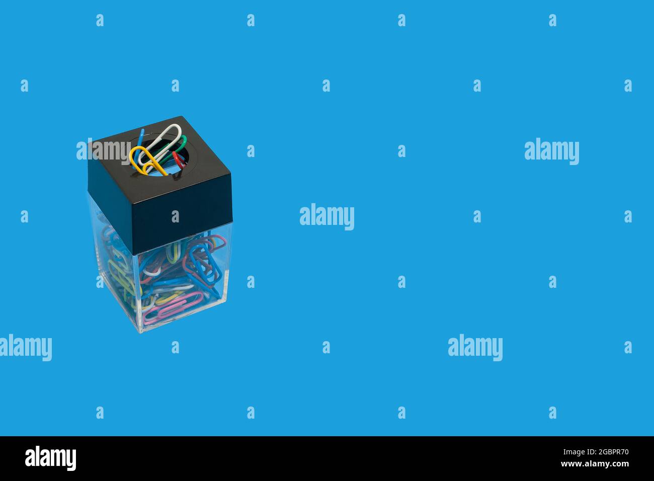 colored paper clips in a box. office accessories Stock Photo