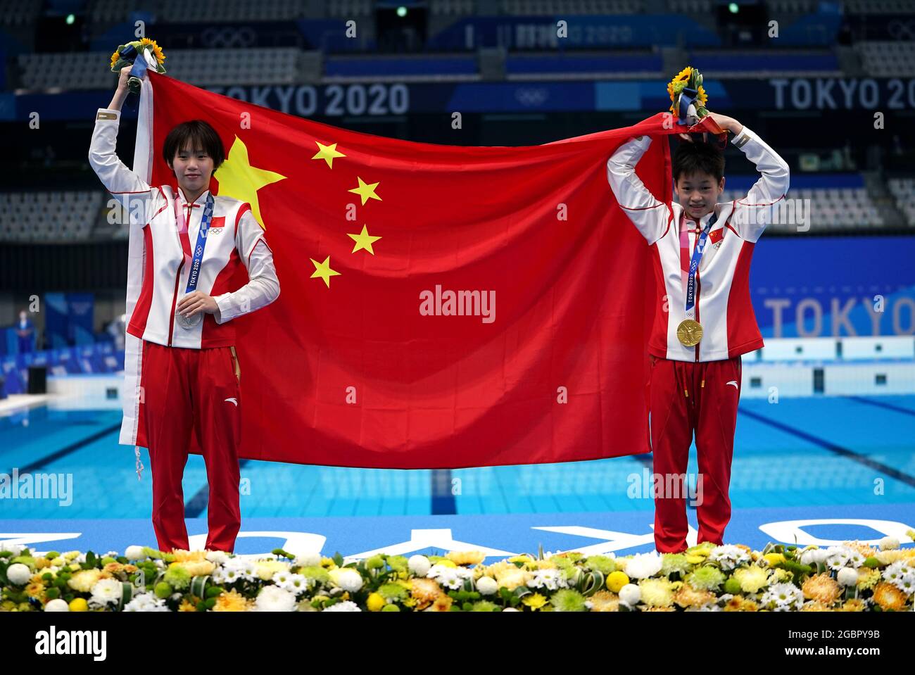 China’s Quan Hongchan and Chen Yuxi with their Gold and Silver medals