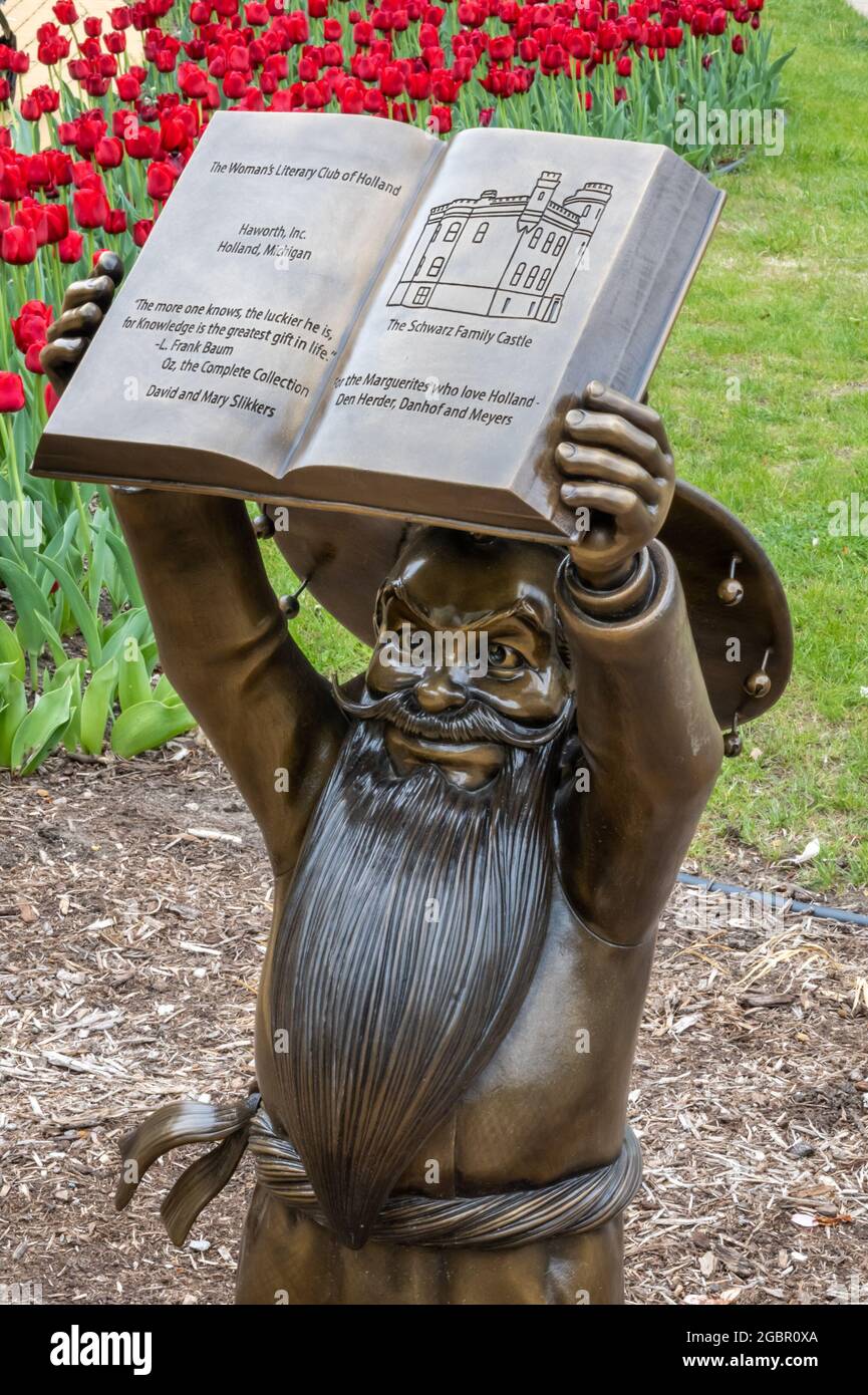 Knowledge Gnome reading a book statue, at Herrick District Library, in